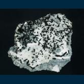 Neptunite on Natrolite