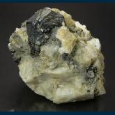 Hematite ( var. Eisenrose ) on Adularia with Rutile and Quartz