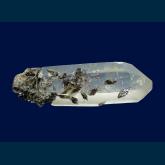 Ferroaxinite on Quartz