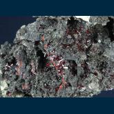 Proustite on Polybasite(?)