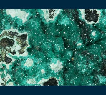 BG93-1 Dioptase on Chrysocolla from Ray Mine, Ray District, near Kearney, Dripping Springs Mts., Pinal County, Arizona, USA